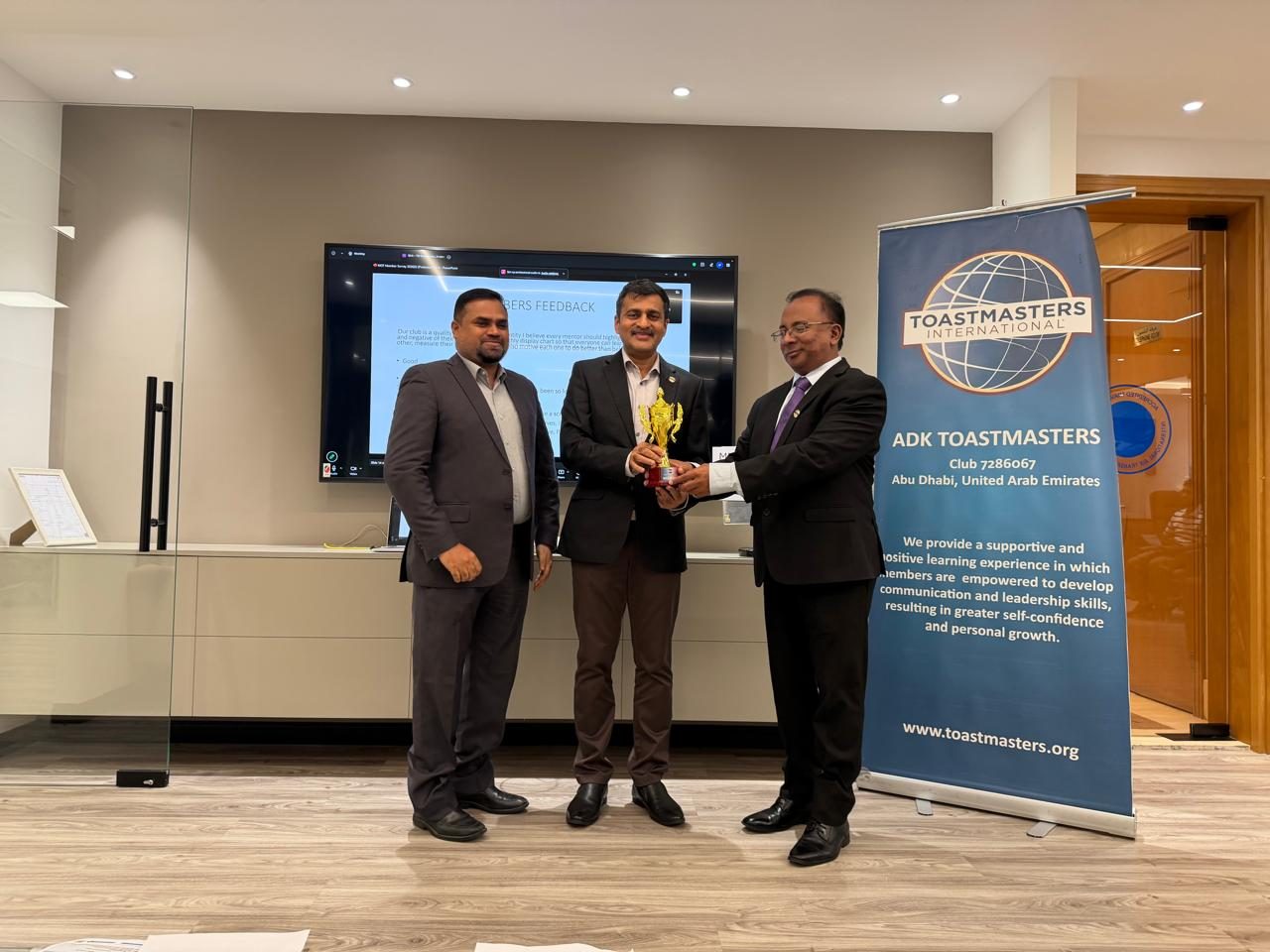 Award presentation at a club meeting